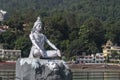 Statue of Shiva, Hindu idol near Ganges River water, Rishikesh, India. The first Hindu God Shiva. Sacred places for pilgrims Royalty Free Stock Photo