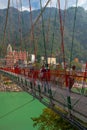 View of Ganga river embankment, Lakshman Jhula bridge and Tera Manzil Temple, Trimbakeshwar in Rishikesh Royalty Free Stock Photo