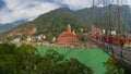 View of Ganga river embankment, Lakshman Jhula bridge and Tera Manzil Temple, Trimbakeshwar in Rishikesh Royalty Free Stock Photo