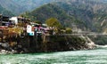 RISHIKESH, INDIA - view to Ganga river, lakshman jhula bridge and colored houses