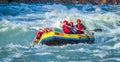 Rishikesh, India - young People on adventure white water river rafting are enjoying water sports in river Ganges