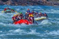 Rishikesh, India - young People on adventure white water river rafting are enjoying water sports in river Ganges