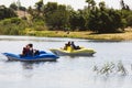 RISHON LE ZION, ISRAEL -APRIL 14, 2018: People ride on pedal boats or paddle boats at the lake in Rishon Le Zion, Israel Royalty Free Stock Photo