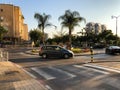 RISHON LE ZION, ISRAEL -APRIL 23, 2018: Roundabout with small fountain on the street with palms in Rishon Le Zion, Israel.