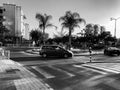 RISHON LE ZION, ISRAEL -APRIL 23, 2018: Roundabout with small fountain on the street with palms in Rishon Le Zion, Israel.