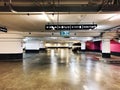 RISHON LE ZION, ISRAEL- JANUARY 3, 2018: Parking garage underground interior, neon lights in dark industrial building Royalty Free Stock Photo