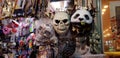 Scary masks and other plastic colorful stuff for children exposed for sale in a shop before jewish purim masquerade
