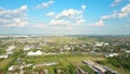 Rising aerial shot of commercial airplane taking off from an international airport Royalty Free Stock Photo