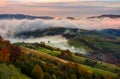 Rising cloud covers rural fields in mountains Royalty Free Stock Photo