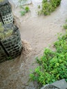 Rising flood water swirls after heavy rains in Indian.