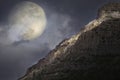 Rising full moon over the rocky summit Royalty Free Stock Photo