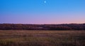 Rising Moon On The Background Of The Evening Sky At Sunset And Meadow