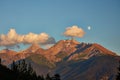 Rising moon and setting Sun over Piz Mitgel massif