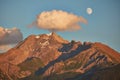Rising moon and setting Sun over Piz Mitgel massif