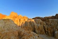 The rising moon at sunset, over the multi-colored eroded rock formations at Wucaitan, Five-Colored Beach, Burqin County, Northern