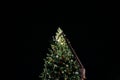 Rising platform gigantic crane setting decorating Christmas tree