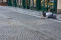PRAGUE, CZECH REPUBLIC Ã¢â¬â JANUARY 22 2020: Lone man begging on the streets of old town among tourists