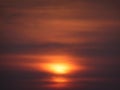 Rising sun behind Golden red Clouds looks like glowing Golden ring Royalty Free Stock Photo