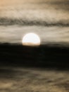 Rising Sun behind The Streaming Clouds Royalty Free Stock Photo