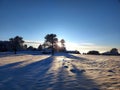 Rising sun in dreamlike winter wonderland in the countryside