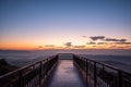 Rising sun in the morning on top of the hill with wooden pathway ahead to sunrise.Success concept