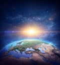 Rising sun on Planet Earth from space Royalty Free Stock Photo