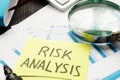 Risk analysis. Magnifying glass and business documents