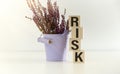 Risk assessment, decision to accept business result in uncertainty, unpredictable situation concept, cube wooden block with