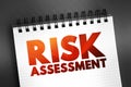 Risk Assessment - process to identify potential hazards and analyze what could happen if a hazard occurs, text on notepad, concept Royalty Free Stock Photo
