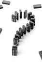 Risk, challenge or uncertainty concept - domino game stones form Royalty Free Stock Photo