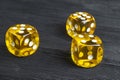 risk concept - playing dice at black wooden background. Playing a game with dice. Yellow casino dice rolls. Rolling the dice Royalty Free Stock Photo