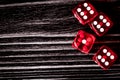 Risk concept playing dice at dark wooden background top view Royalty Free Stock Photo