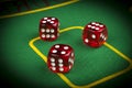 risk concept - playing dice on a green gaming table. Playing a game with dice. Red casino dice rolls. Rolling the dice concept Royalty Free Stock Photo