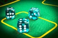 risk concept - playing dice on a green gaming table. Playing a game with dice. Blue casino dice rolls. Rolling the dice concept fo Royalty Free Stock Photo