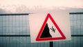 Danger risk of falling sign in the mountains. French Alps Royalty Free Stock Photo
