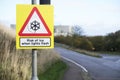 Risk of ice when light flashes winter road safety sign Royalty Free Stock Photo