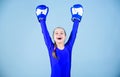 Risk of injury. Female boxer change attitudes within sport. Rise of women boxers. Girl cute boxer on blue background