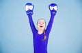 Risk of injury. Female boxer change attitudes within sport. Rise of women boxers. Girl cute boxer on blue background