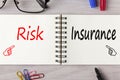 Risk and Insurance written on notebook concept Royalty Free Stock Photo