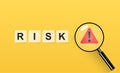 Risk management and analysis concept with magnifier and acclamation sign Royalty Free Stock Photo