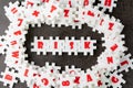 Risk management concept, white puzzle jigsaw with alphabet building the word Risk at the center of dark chalkboard Royalty Free Stock Photo