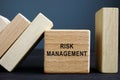 Risk management concept. Wooden cube and bricks with domino effect