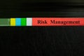 Risk management file record in black binder folder. Risk management business concept. Royalty Free Stock Photo
