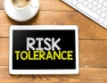 RISK TOLERANCE words on the screen of the tablet