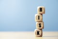 Risk wording print screen on wooden block cube for financial banking risk analysis and management ,Low risk low return concept Royalty Free Stock Photo
