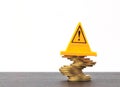 Risky coin stack and Warning label on white background.Financial crisis concept. Royalty Free Stock Photo