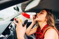 Risky girl doing makeup while driving car