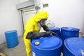 Risky job - Professional in uniform filling barrel Royalty Free Stock Photo