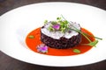 Risotto from black rice with fish in tomato sauce. Italian restaurant. Menu. Royalty Free Stock Photo