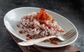 Risotto with red radicchio and crispy bacon speck Royalty Free Stock Photo